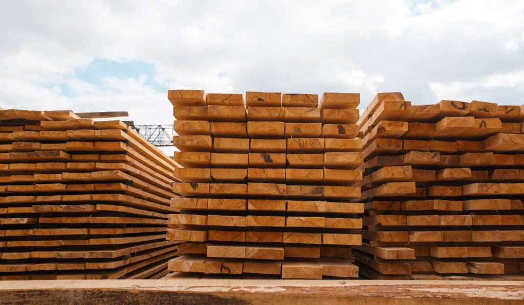Stacks of boards on timber mill warehouse